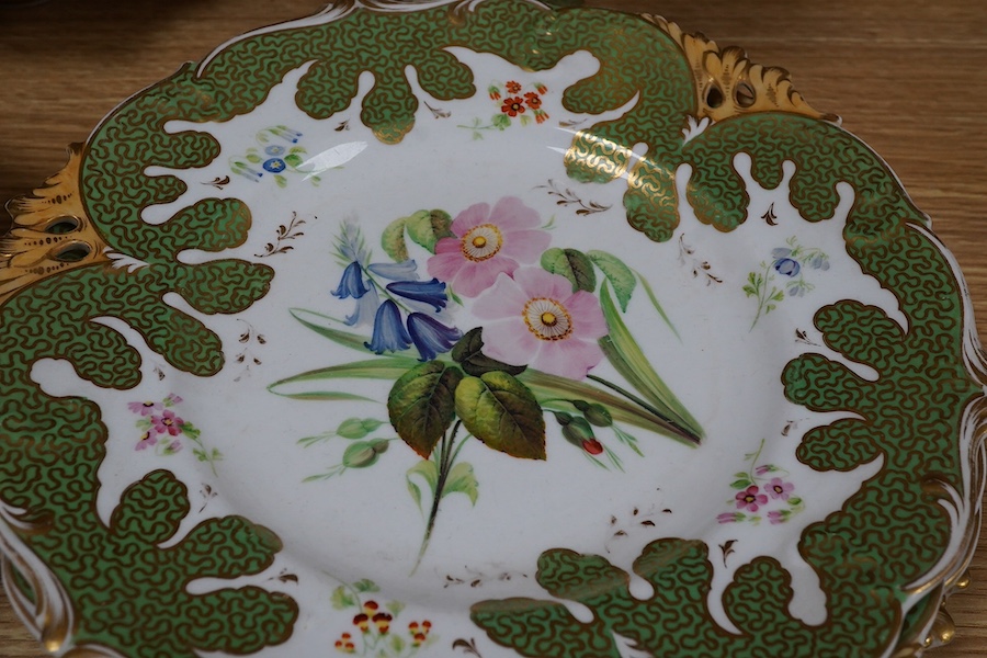 A circa 1835 part dessert set of floral and gilt decorated Rockingham style china, pattern number 6626, centrepiece 34cm wide. Condition - small comport cover cracked badly, some wear to gilding and pattern on plates